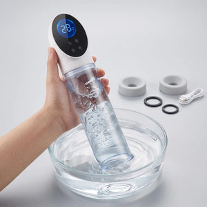 Electric vacuum erection device demonstrating strong automated suction power by drawing water from a glass basin.