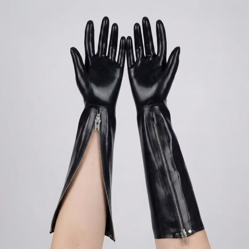 Detailed view of black latex gloves with one zipper fully closed and the other partially open.