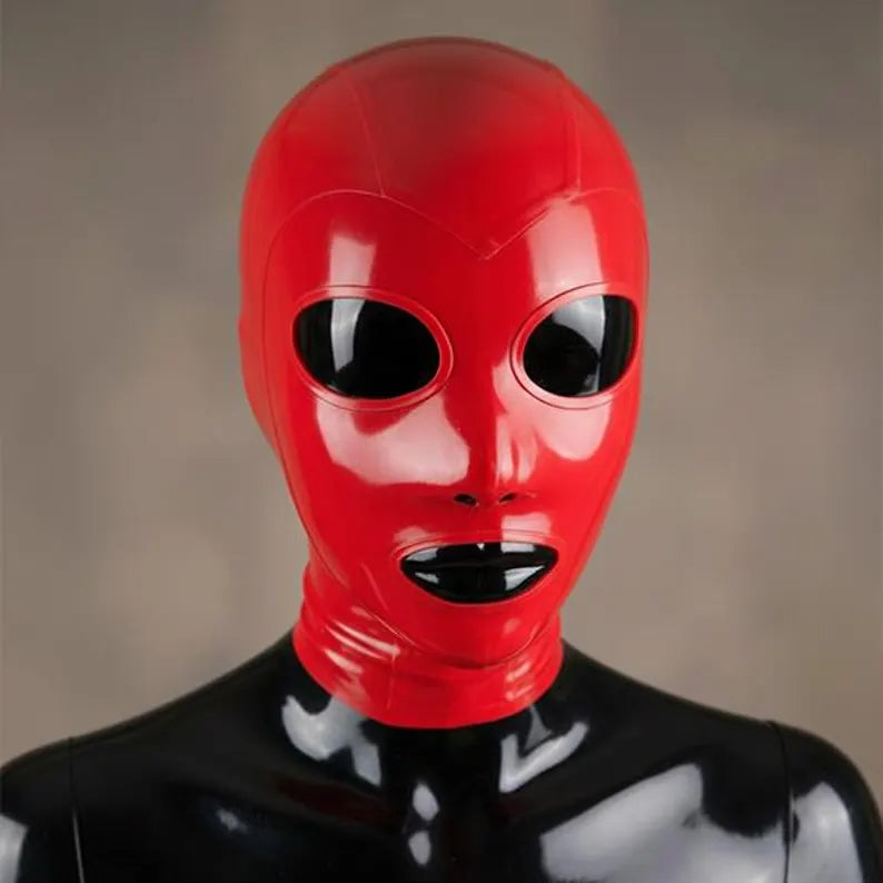 Front view of a tight-fitting red latex full face hood worn by a shiny black mannequin. The mask has precise cutouts for the eyes, nose, and mouth, revealing the mannequin underneath.