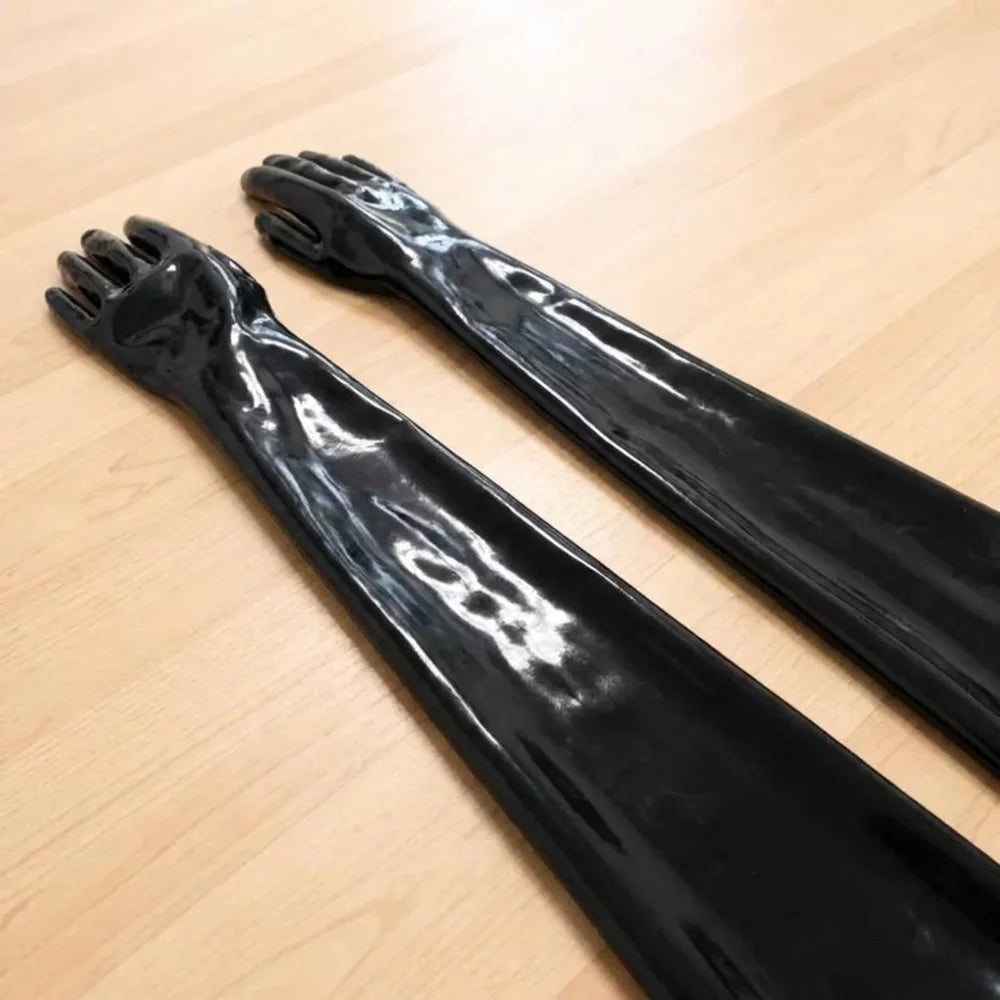 pair of gloves on a clear wooden desk