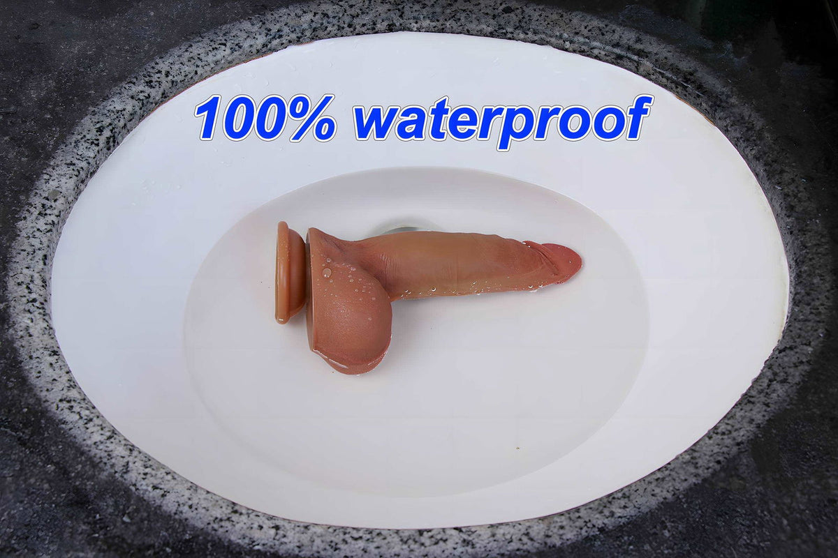 Cannon spraying dildo submerged in a sink, showing the waterproof silicone body