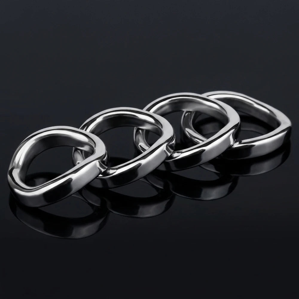 Four Stainless Steel Contoured Cock Rings displayed on a black reflective surface