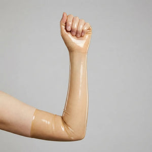 an arm showing opera latex glove in transparent coloration