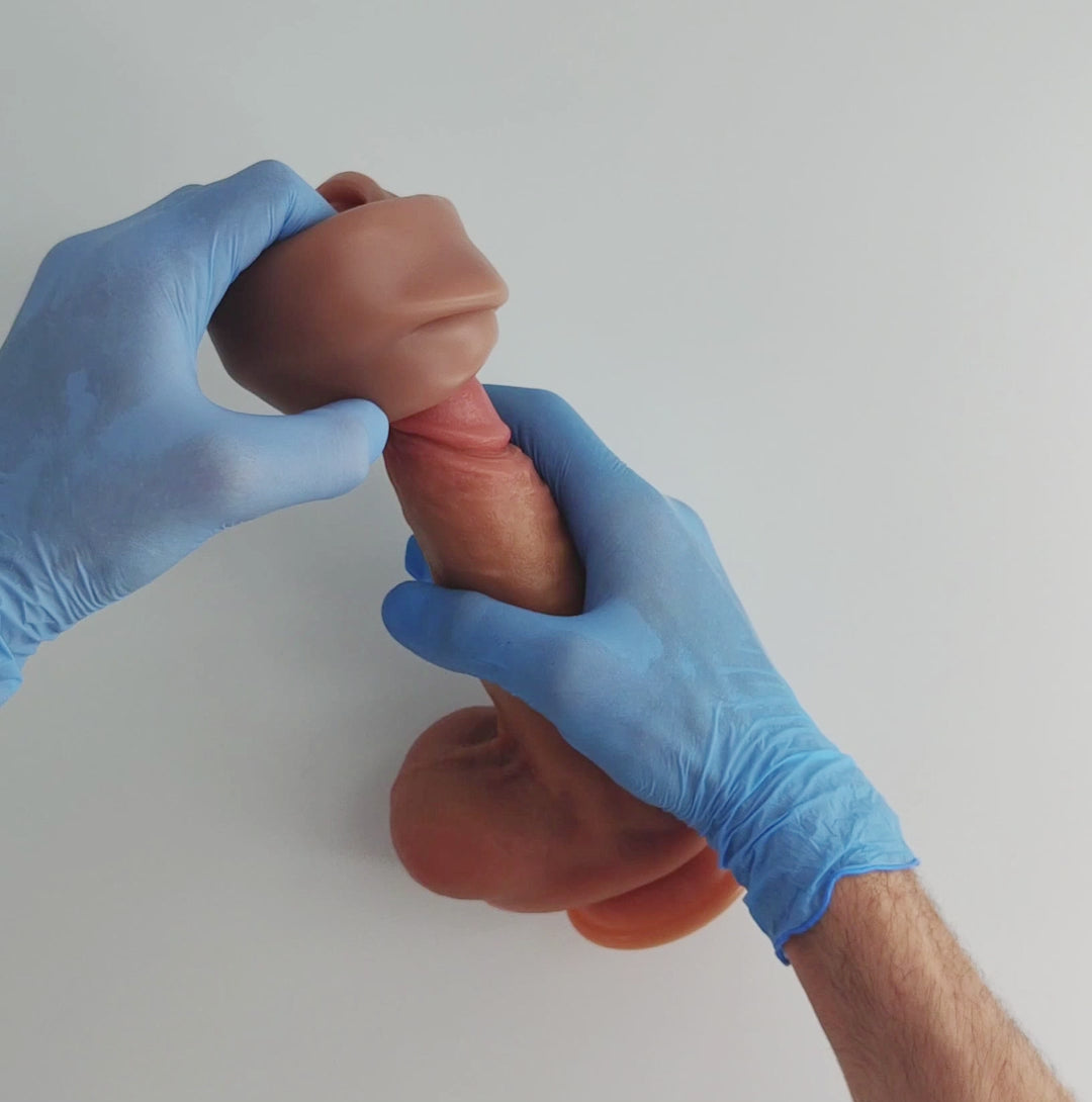 example of how to wear the realistic penile sleeve, a dildo is used as a test dummy, then a test is performed to show how the penile sleeve remains adhered to the dildo despite movement, to show that it will remain firm to the penis during penetration