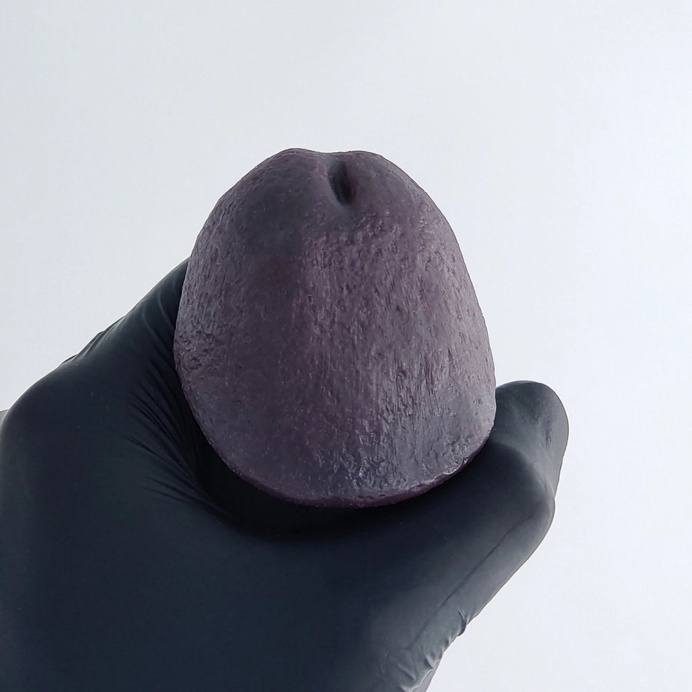 Close up of realistic black penis sleeve head detail