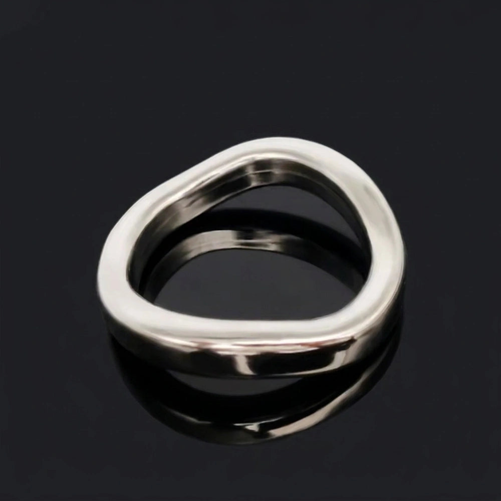 Stainless Steel Contoured Cock Ring on a black reflective surface